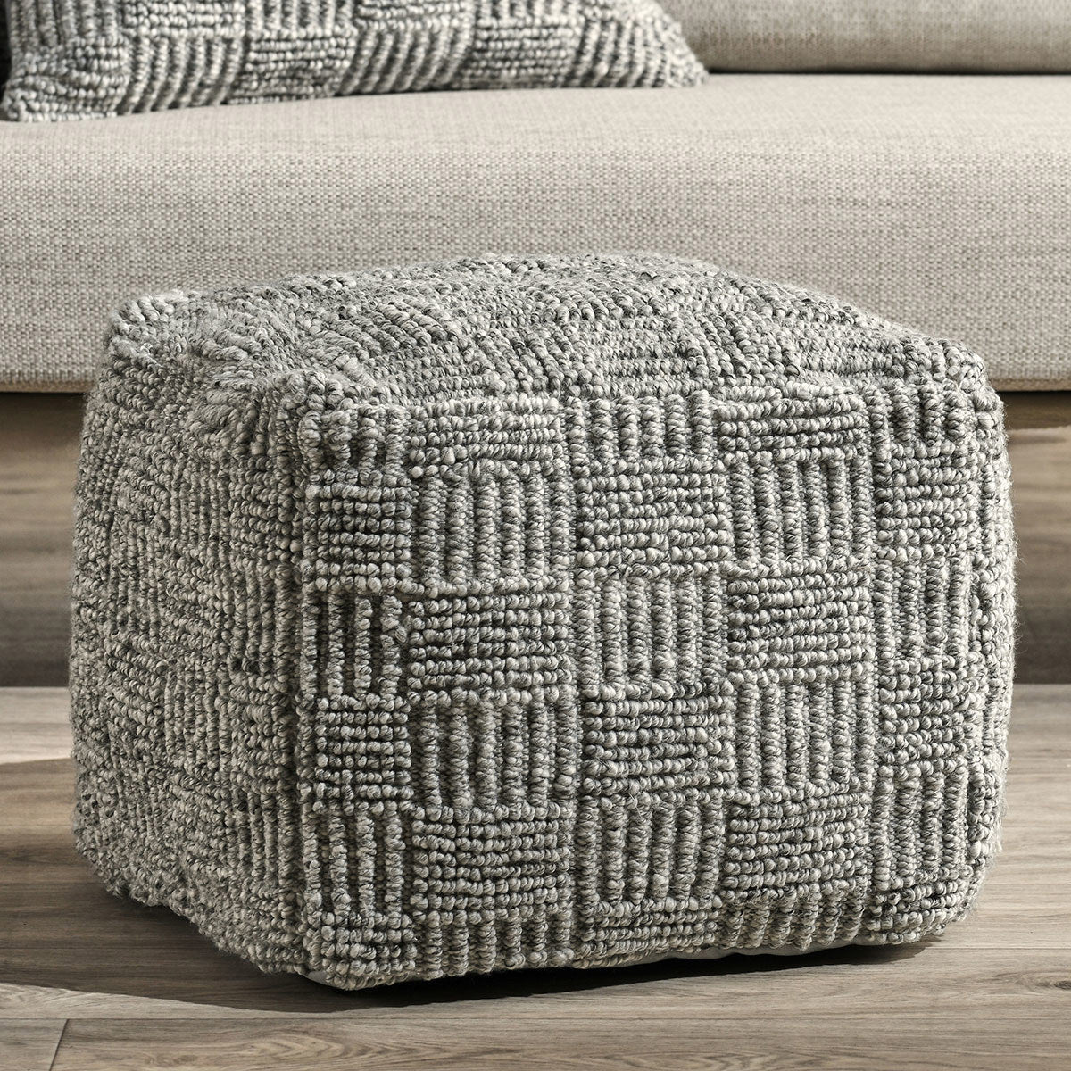 grey cushioned ottoman