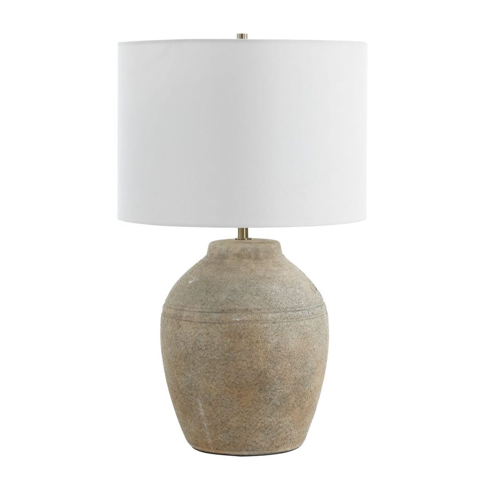 earth toned round table lamp with white shade